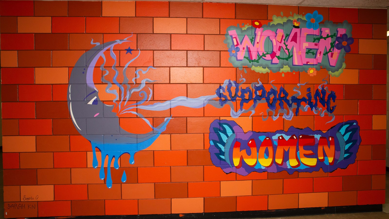 Students Sarah Karaim Normand and Sophia Gillespie created a colourful mural that adorns the downstairs hallway at Churchill. The message is simple: “women supporting women.”